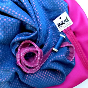 Mood Fabrics: blue metallic brocade, pink silk lining, matching beaded trim, thread and zipper.