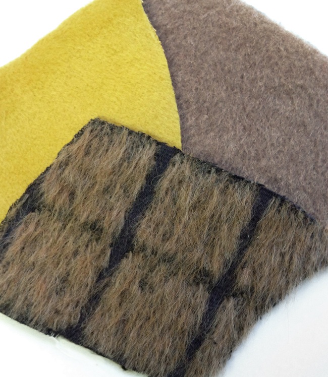 swatches of different alpaca fabrics available at Mood NYC.