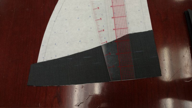 Use the ruler to mark a slightly curved 2" strip. It's okay if bits are missing, as long as nothing goes past the seam allowance.
