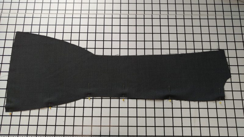 Center back seam, pinned. Press the pieces before sewing them, and baste the curved seams in the hip area.